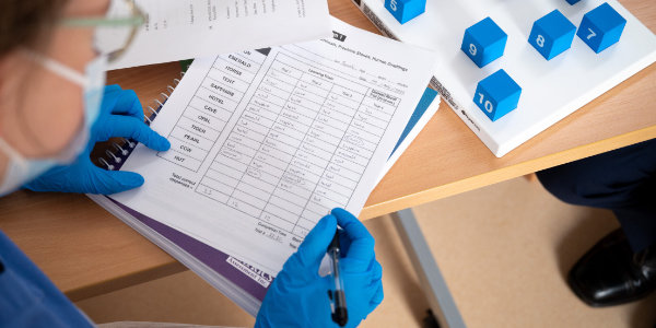  A clinician undertaking research with a volunteer.