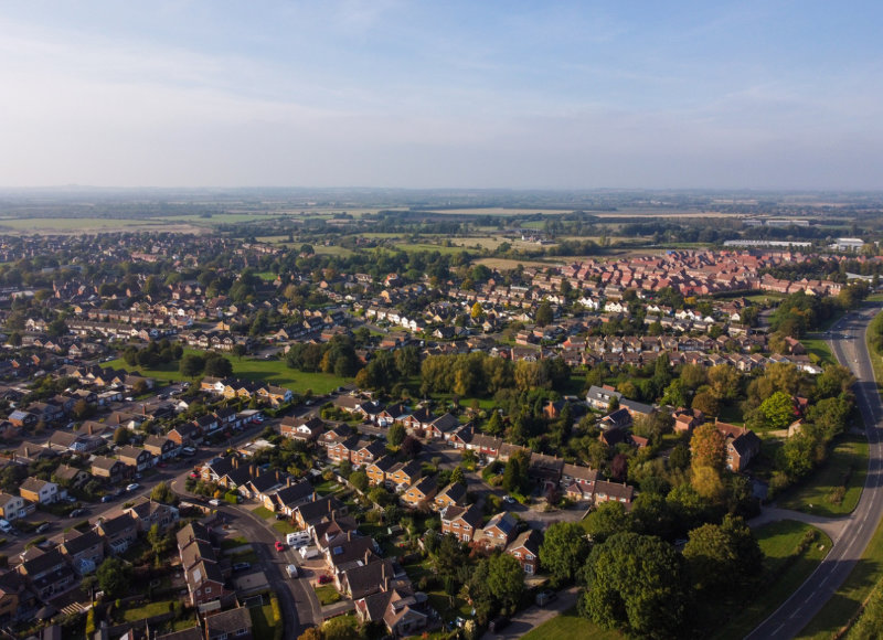 An Oxfordshire neighbourhood from above, showing houses, streets and recreational space.