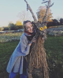 Hannah-Louise Toomey hugging a straw stag