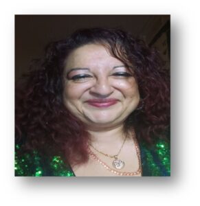 Lady smiling against a black background