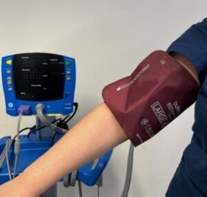 A blood pressure cuff on an arm