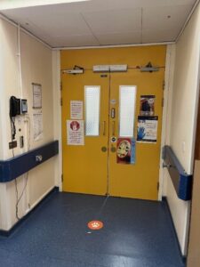 A set of yellow hospital doors